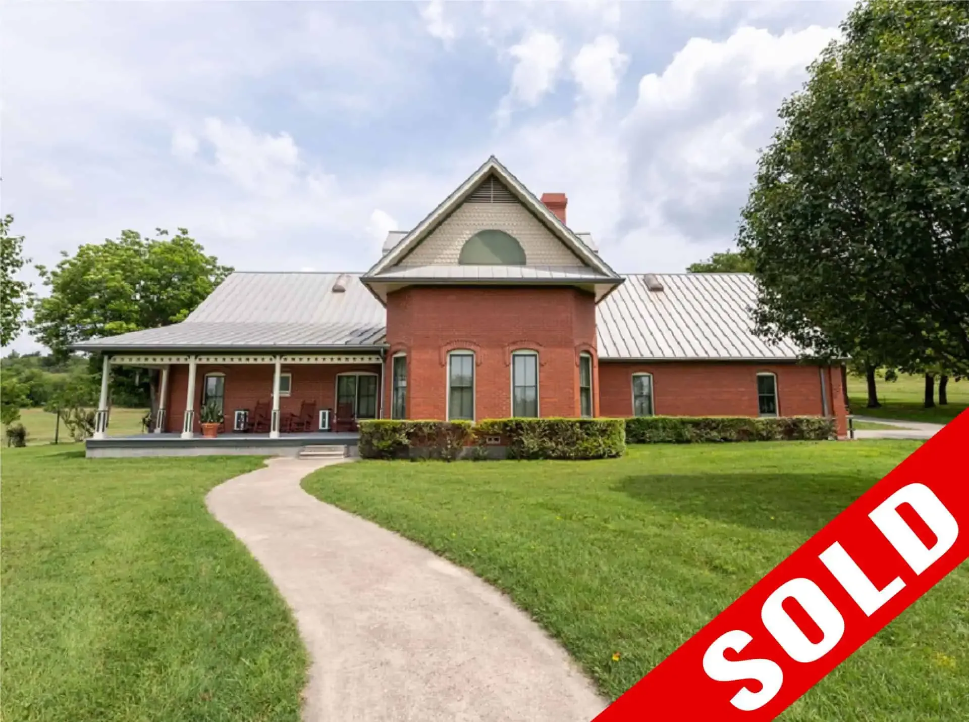 Elite North Texas Ranch — the brick main residence, marked sold